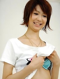 Perky Miriya Hazuki in green satin toyed with a vibrator